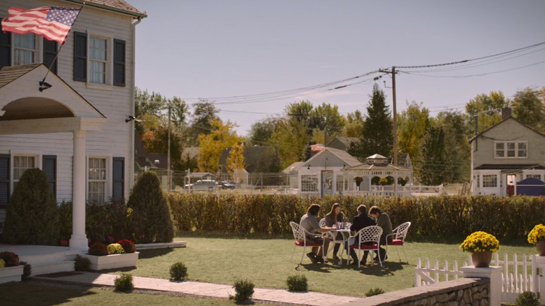 Joel, Tess, Bill, and Frank sitting at a garden table