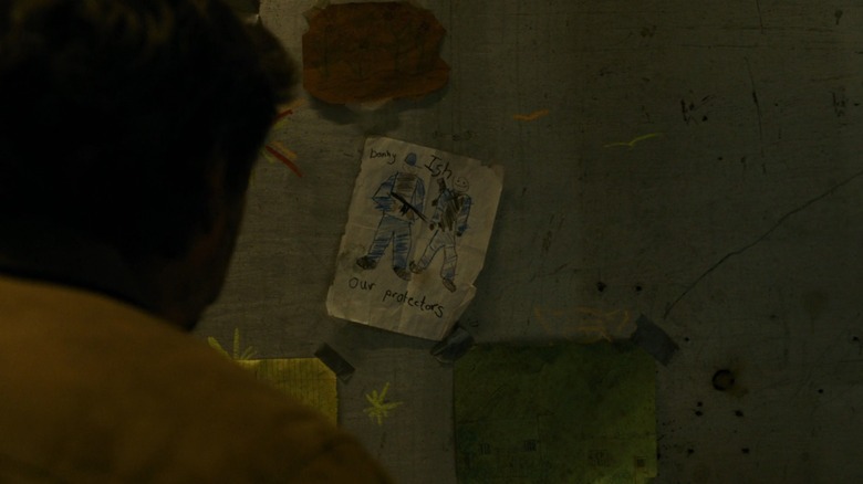 Sam looking at Ish painting in The Last of Us