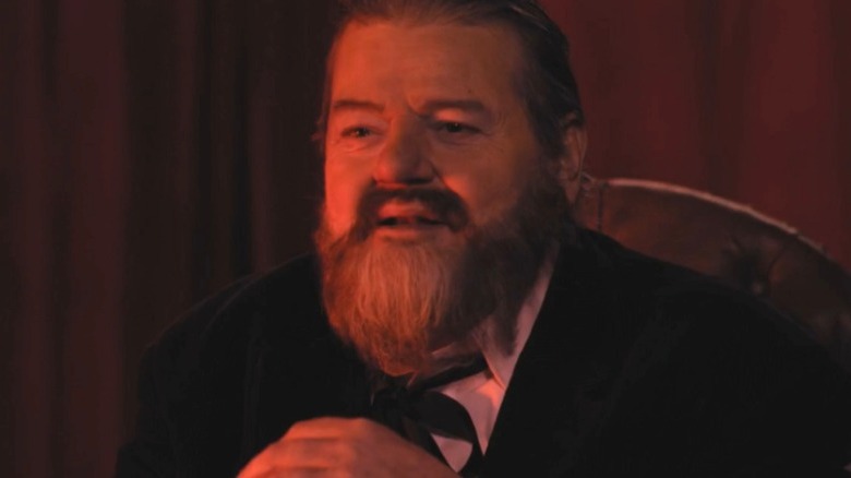 Robbie Coltrane as Orson Welles smiling