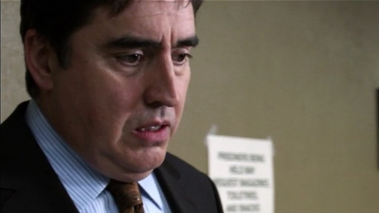 Alfred Molina looking distraught