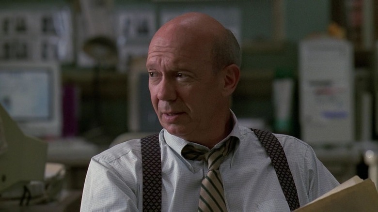 Donald Cragen looking up from files