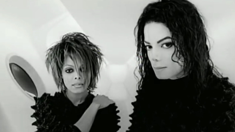 Michael Jackson and Janet Jackson standing together