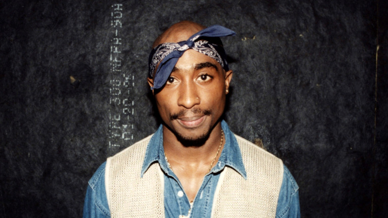 Tupac posing backstage