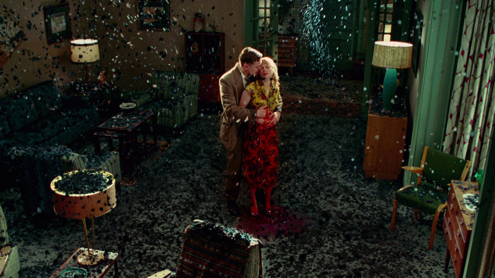 Leonardo DiCaprio holds Michelle Williams in Shutter Island