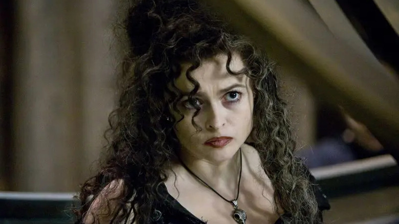 Bellatrix peering out from under a structure in Harry Potter and the Order of the Phoenix