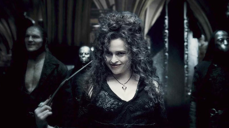 Bellatrix pointing a wand at her own head in Harry Potter and the Half-Blood Prince