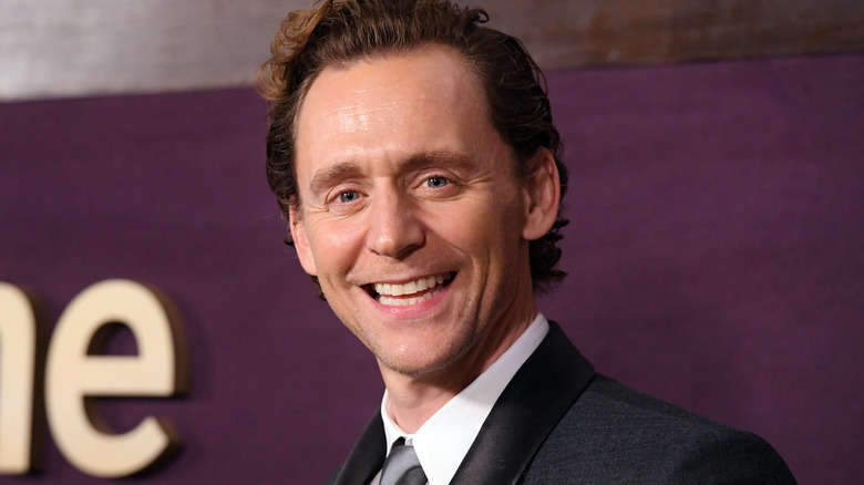 Tom Hiddleston looks to camera