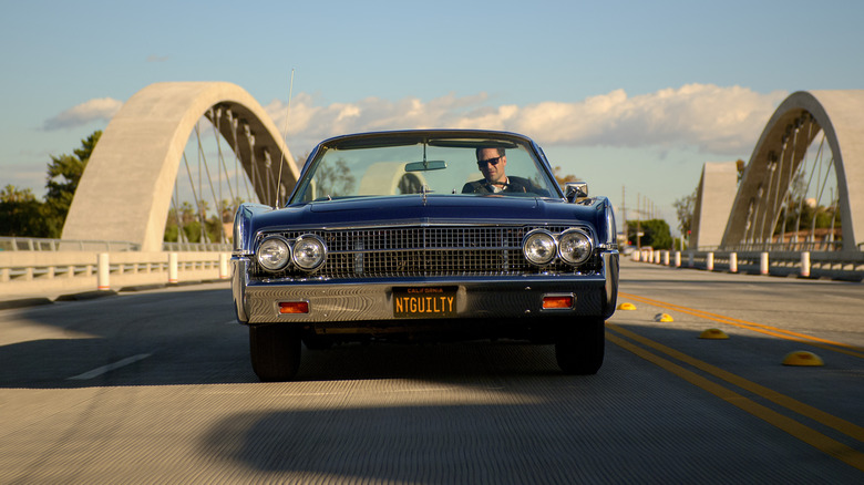 Mickey Haller driving across bridge in Lincoln