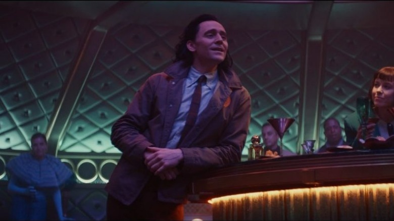 Loki talking on a train