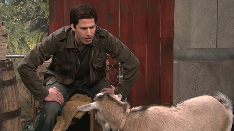 Andy Samberg talking to a goat