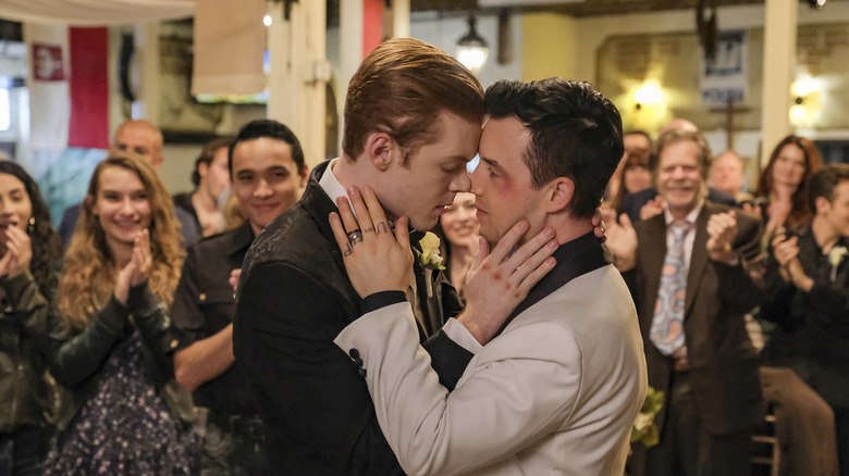 Mickey kissing Ian at their wedding