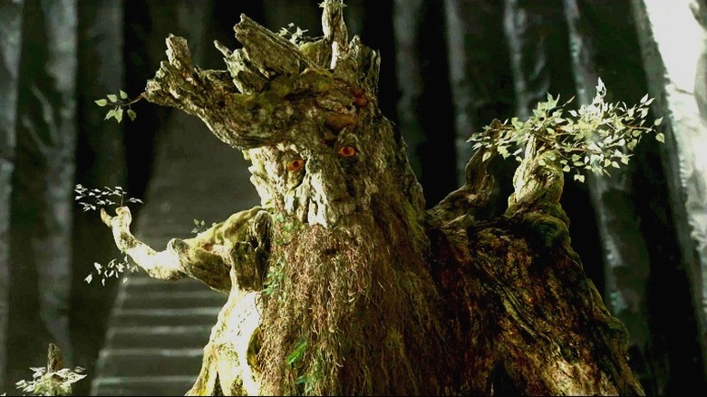 Treebeard standing in front of Saruman's tower