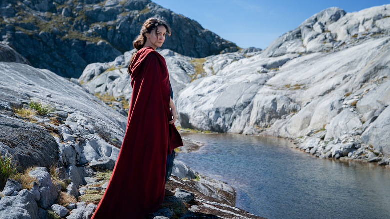 Bronwyn wearing a red cape