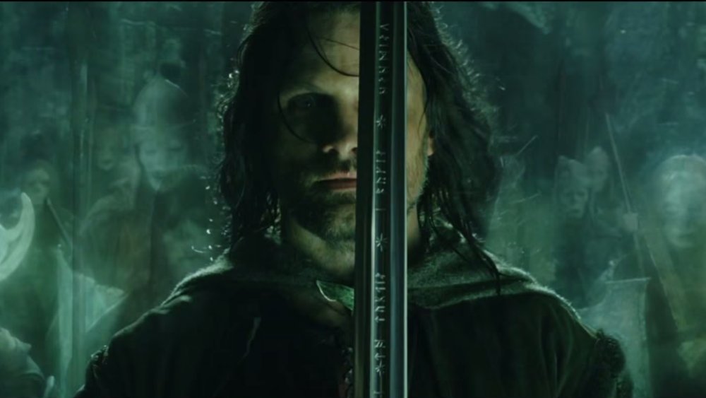 Viggo Mortensen as Aragorn and his sword Andúril in The Lord of the Rings