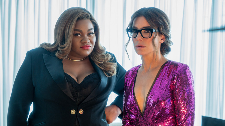 Da'Vine Joy Randolph and Sandra Bullock looking skeptical in "The Lost City"