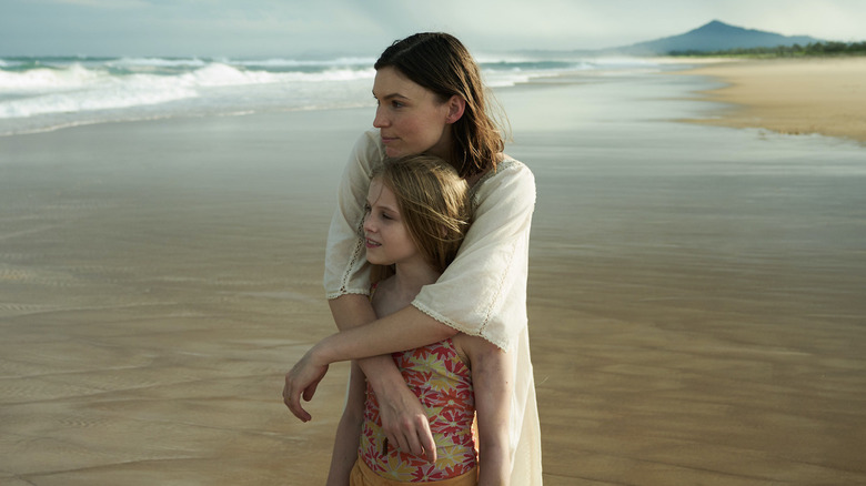 Young Alice and her mom by the ocean