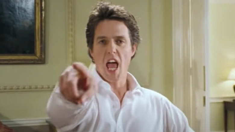 Hugh Grant dances and points