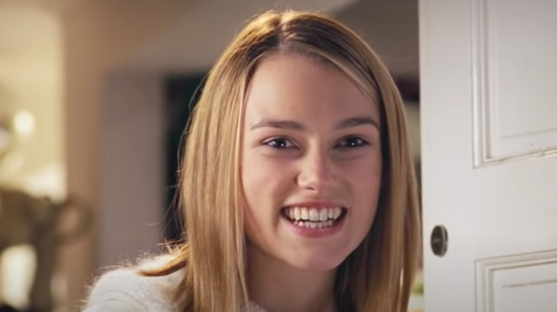 Keira Knightley smiles in doorway