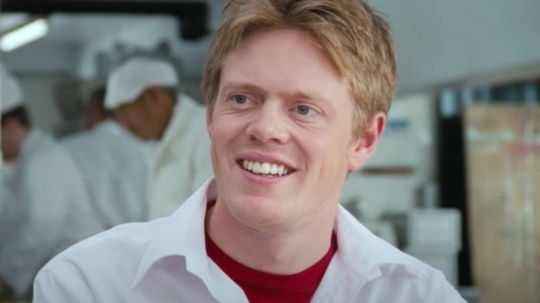 Kris Marshall smiles in kitchen