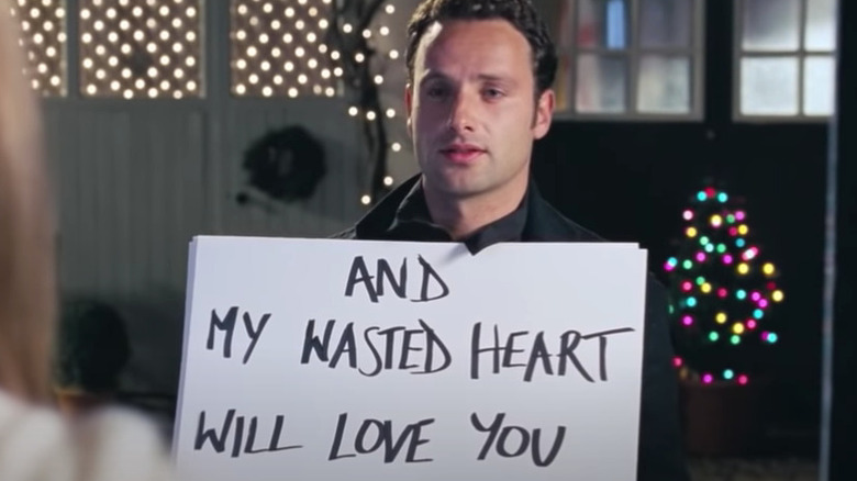 Andrew Lincoln holds placard