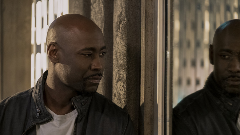 D.B. Woodside contemplating his reflection as Amenadiel in Lucifer