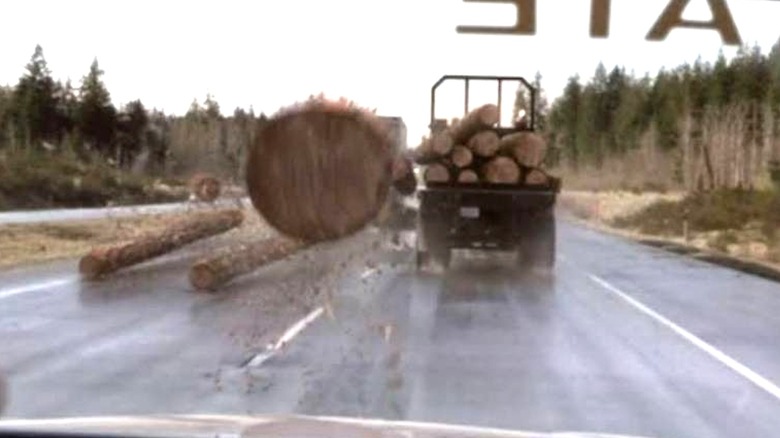 Log flying toward car