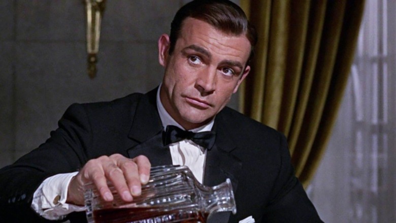 James Bond pours liquor