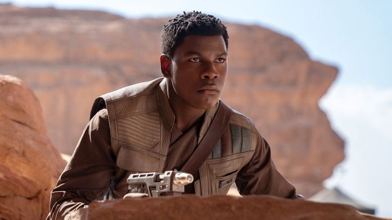 Finn looking intense with a blaster