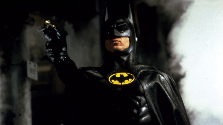 Michael Keaton Batman aiming grapple gun