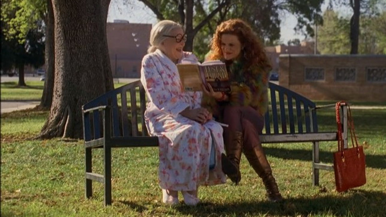 Patty and her mom reading a book and laughing