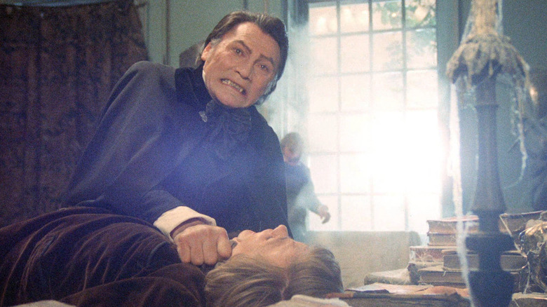 Jack Palance grabs a man