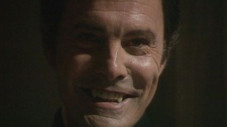 Louis Jourdan shows fangs