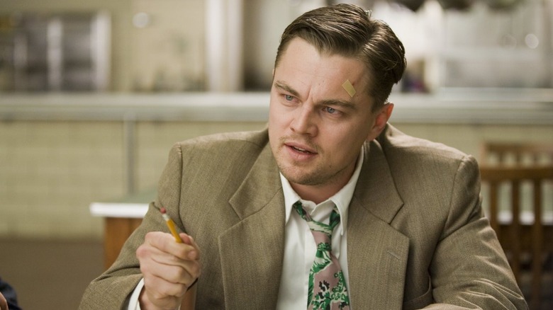 Leonard DiCaprio brandishing a pencil. 