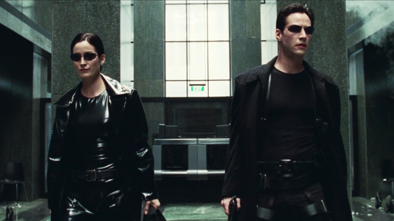 Trinity and Neo wearing sunglasses