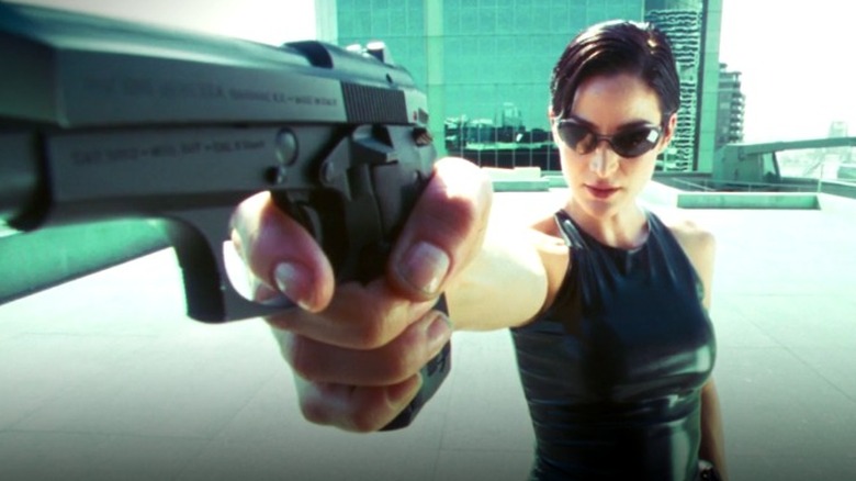 Trinity's outstretched gun in The Matrix