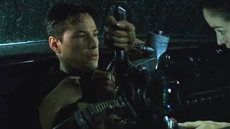 Trinity extracting the bug from Neo in "The Matrix" 