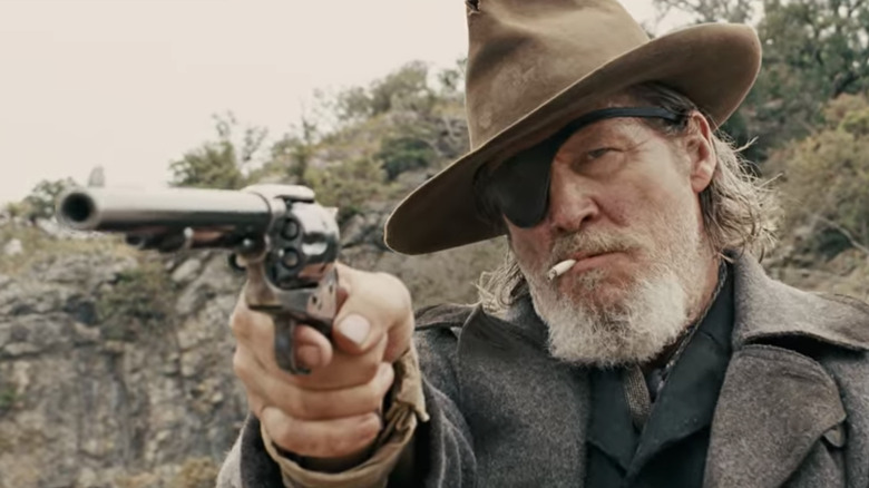 Cogburn aims his gun at Labeouf