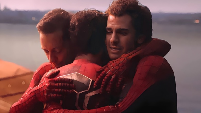 The three Spider-Men hug