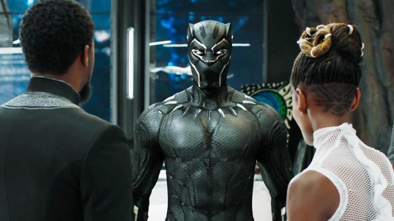 T'Challa (Chadwick Boseman) and Shuri (Letitia Wright) look at the new Black Panther suit