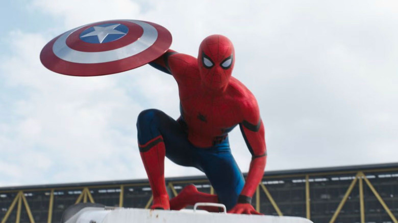 Spider-Man holding Captain America's shield