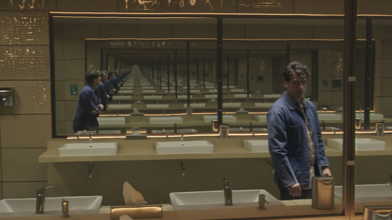 Steven talking to Marc in bathroom mirror