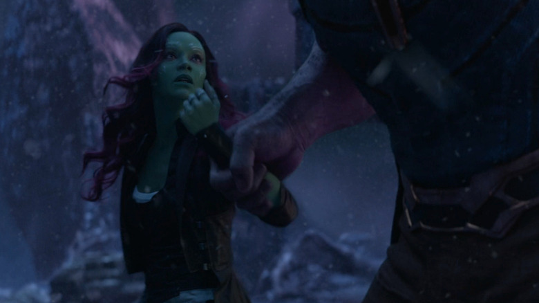 Thanos dragging Gamora to the cliff's edge in Infinity War