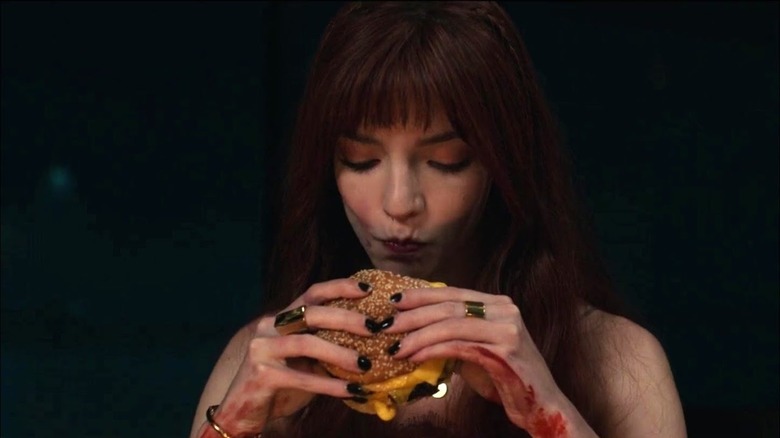 Margot eating a cheeseburger