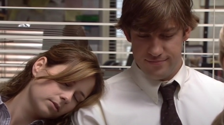 Pam asleep on Jim during a meeting