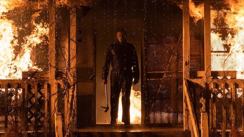 Michael Myers standing in burning house