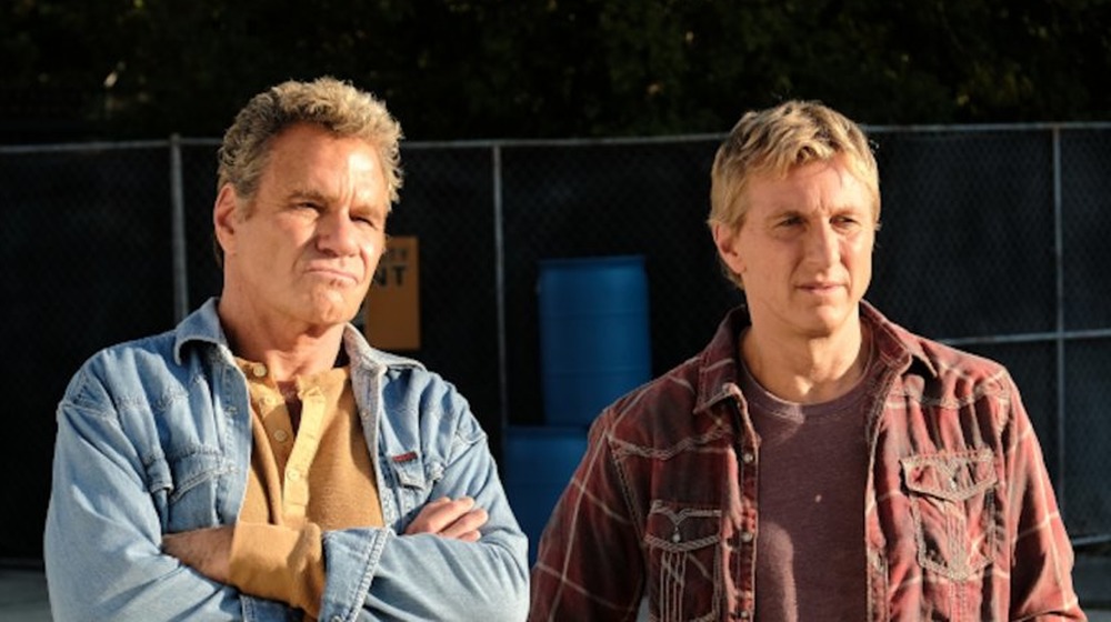 Martin Kove (left) plays John Kreese, and William Zabka (right) plays Johnny Lawrence in the Netflix series Cobra Kai