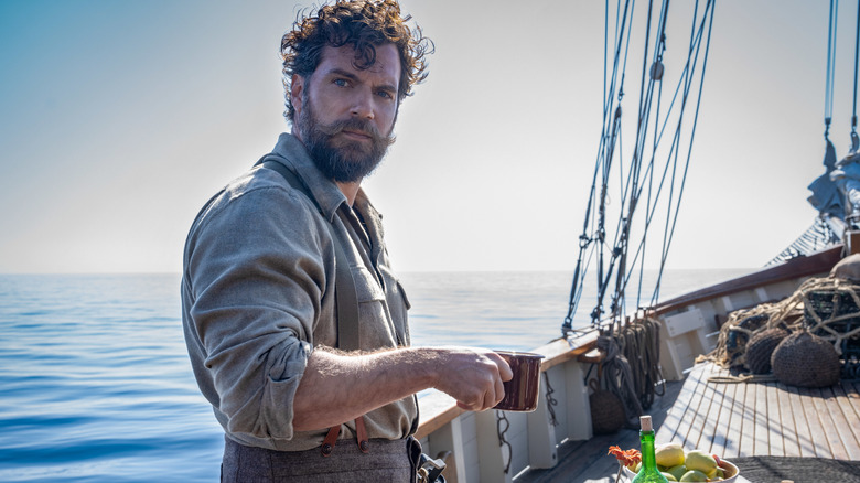 Gus drinking on boat