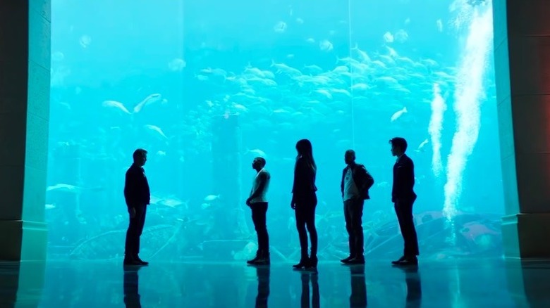 The Misfits group against an aquarium