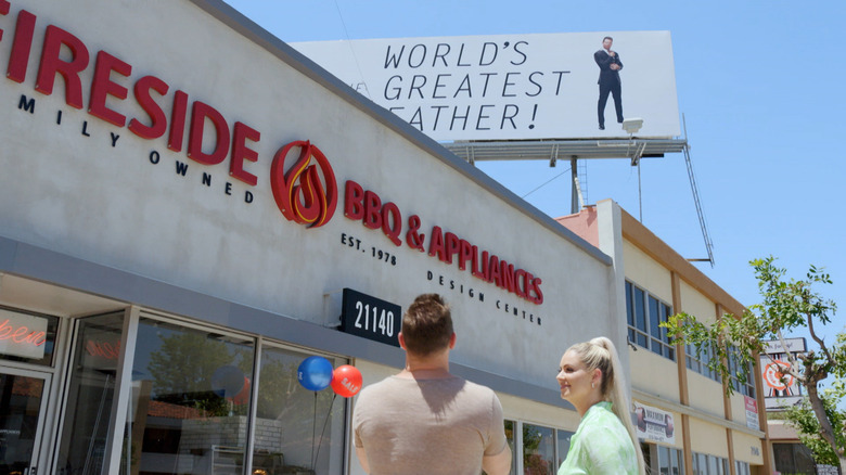 Miz and Maryse looking at billboard of The Miz