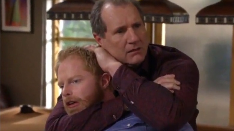 Jesse Tyler Ferguson and Ed O'Neill in clinch